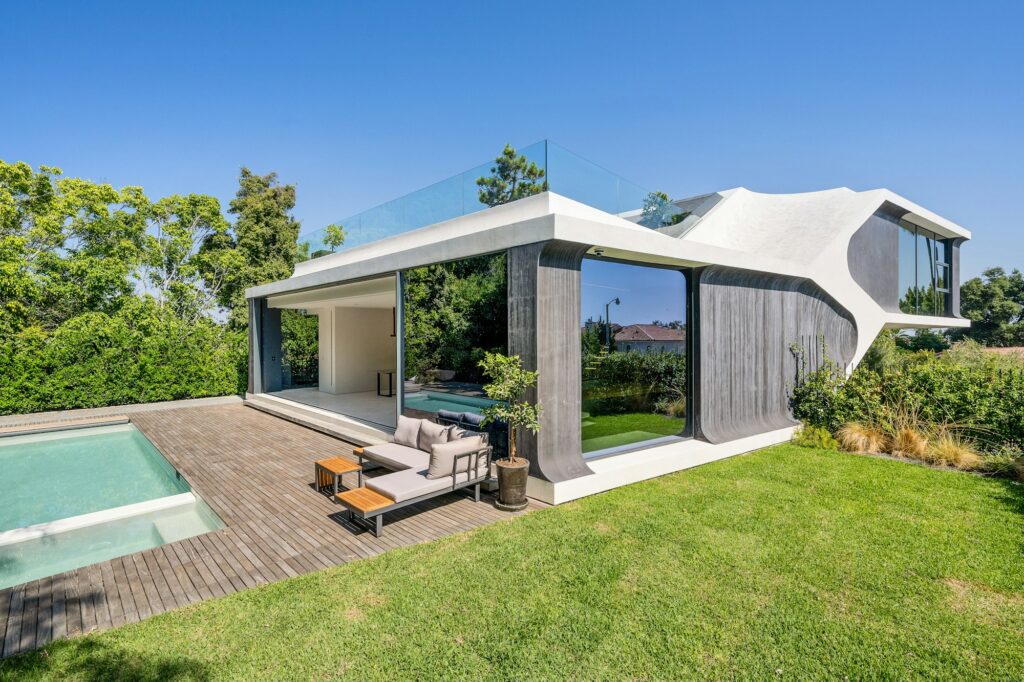 the view of the backyard with pool and loungers in the house the view of the backyard with pool and loungers in the house